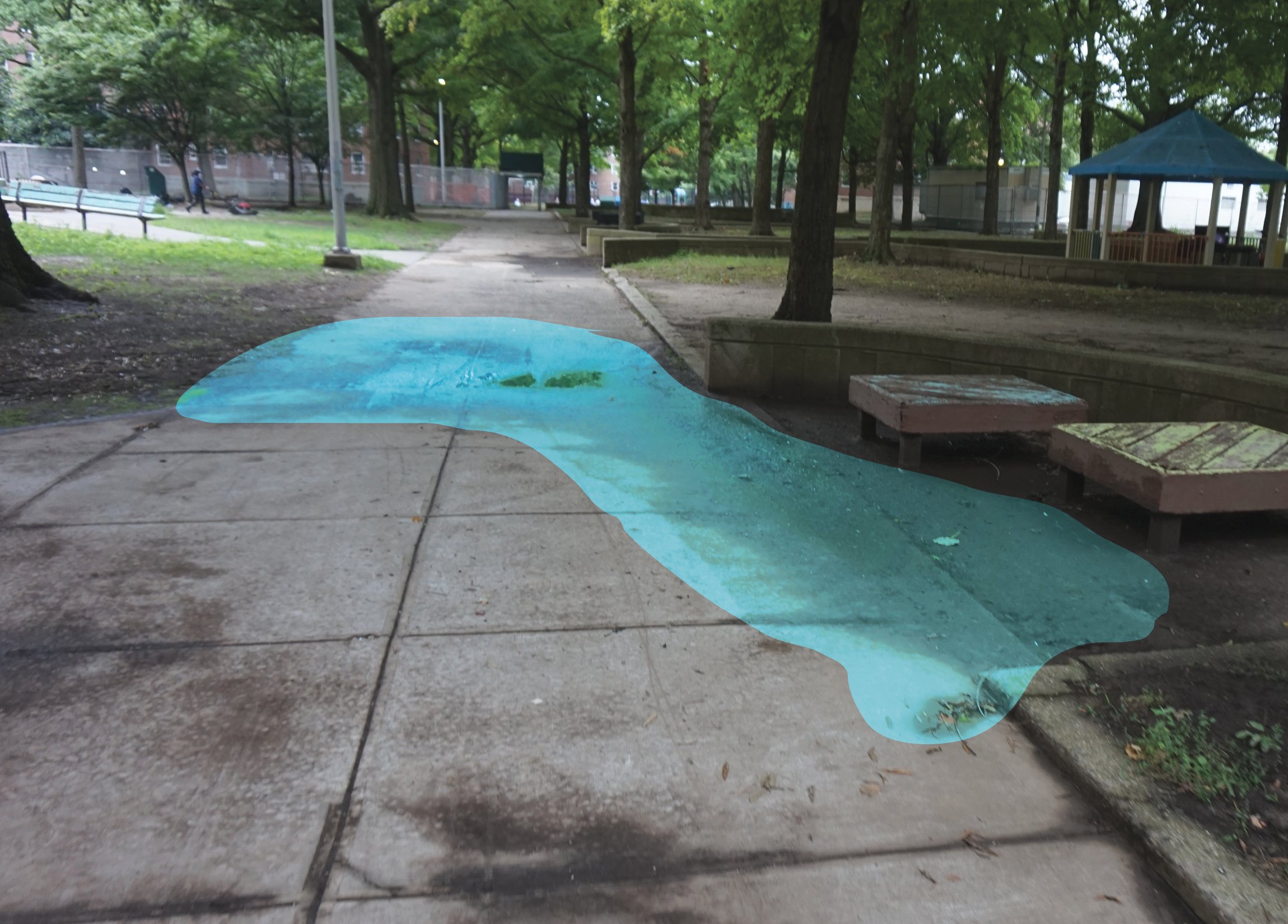 Stormwater accumulates and deposits dirt along sidewalks