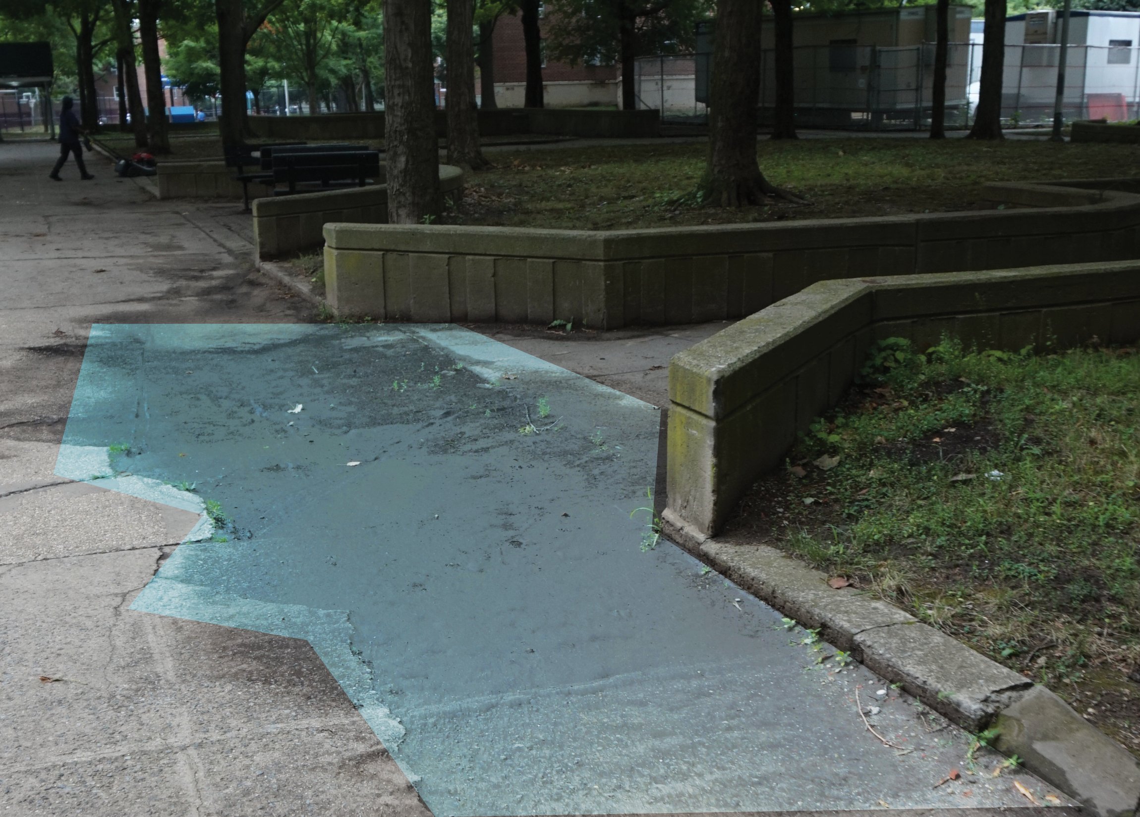 Patches of sidewalk covered in dirt show previous extents of flooding